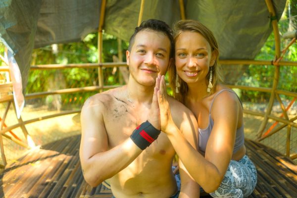 Couple smiling while on a yoga retreat