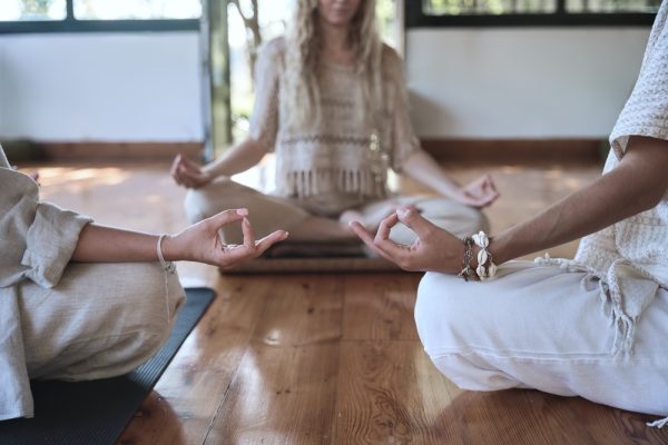 Two students in a class with a meditation coach