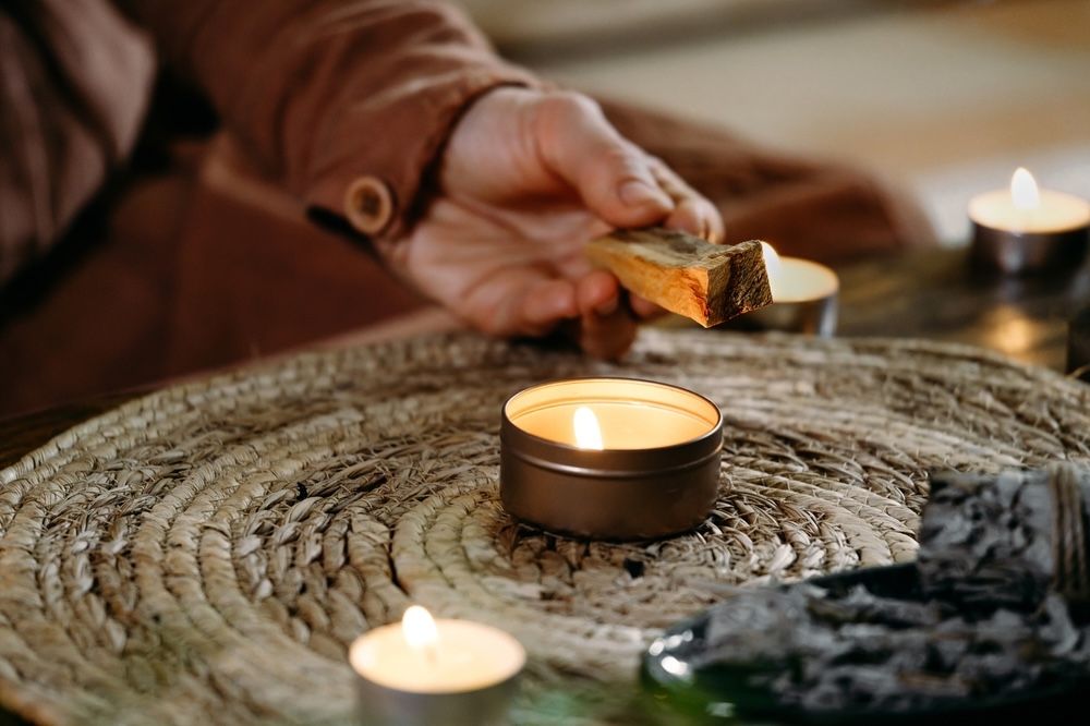 Closeup of meditation candles being lit up