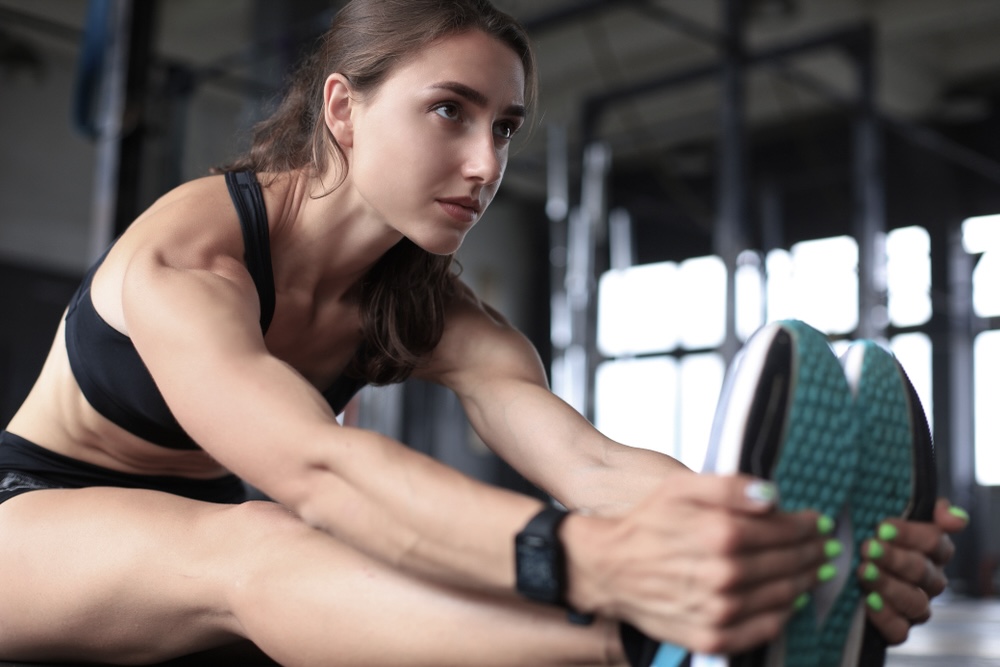 Female doing stretching exercises before a workout